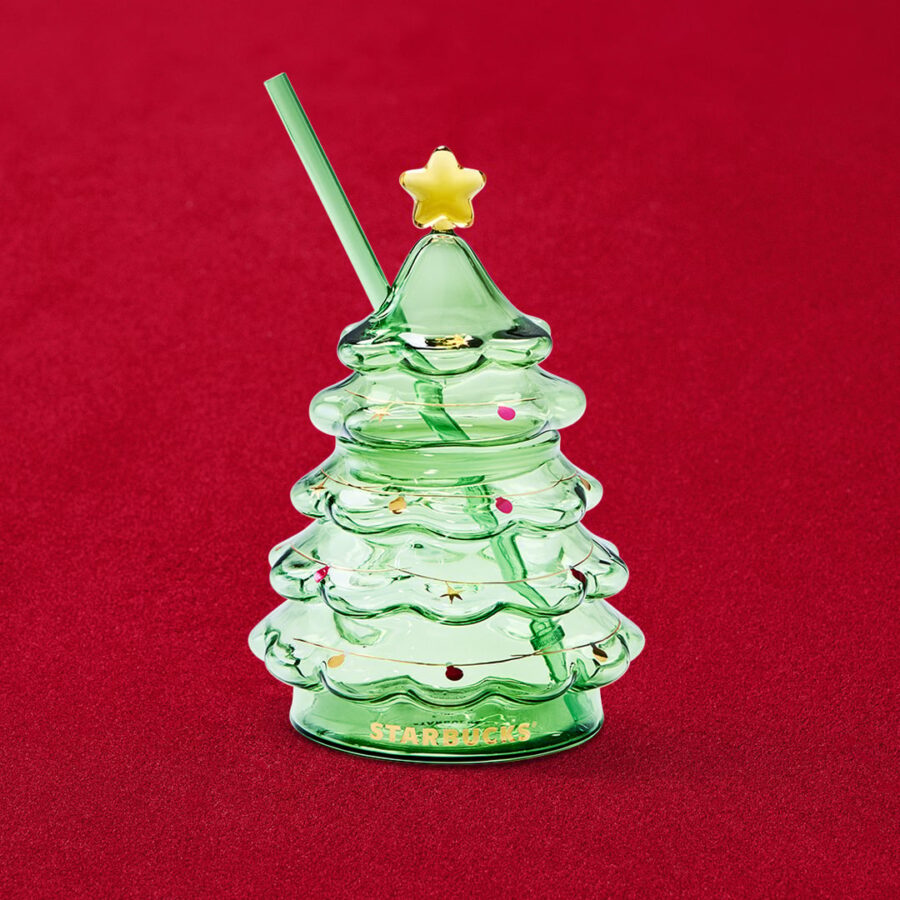 Starbucks green glass Holiday Tree Cold Cup with gold star topper, shown in full